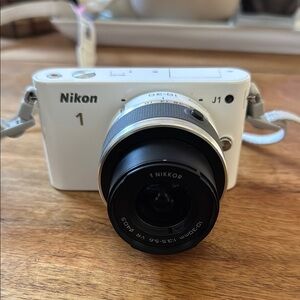 Nikon White Digital Camera with Mirrorless Design and Standard Zoom Lens